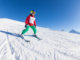 Young pupil skiing on school ski trip